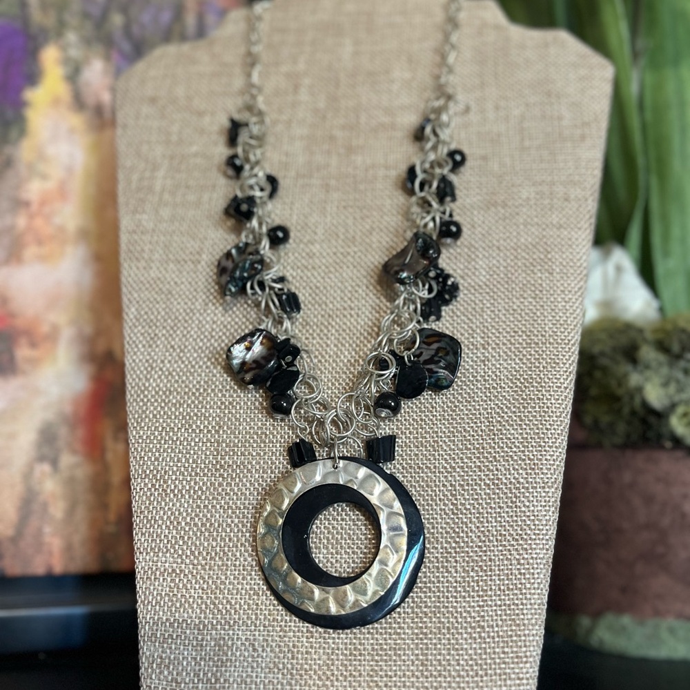 Women’s black and silver necklace